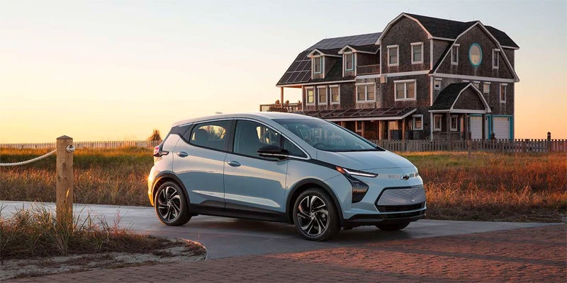 2023 Chevrolet Bolt Parked Next To a House